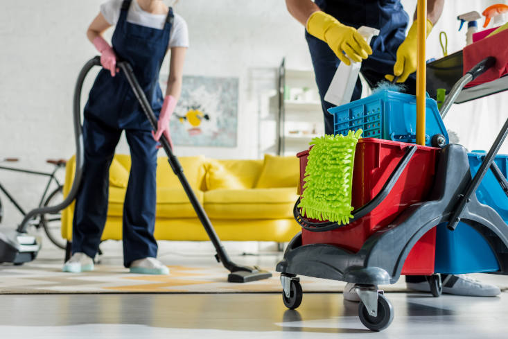 Cropped view of professional cleaners deep cleaning a home Depositphotos 355770670 XL
