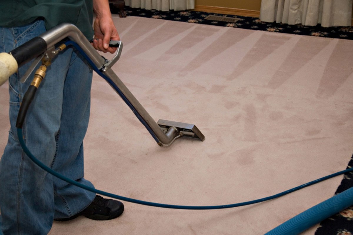 carpet cleaning wand and pink rug
